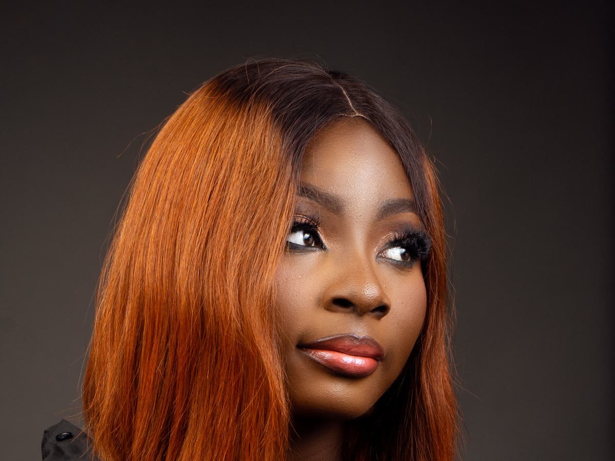 Copper bob with dark roots and a soft face-framing shape, styled at Velvet Fig Studio